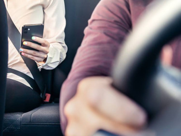 Woman in rideshare vehicle