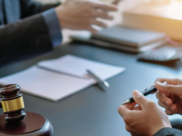 A lawyer discusses the causes of car accidents in Texas with a client.