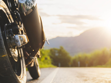 The wheel of a motorcycle that complies with Houston motorcycle insurance requirements on the road