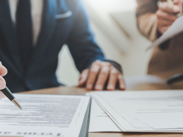 An attorney talks to a client about how to file a personal injury lawsuit