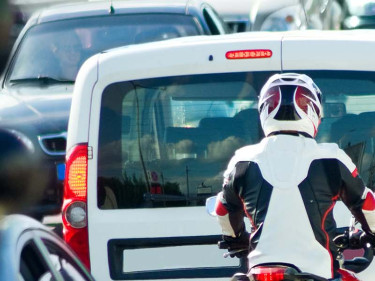 Is lane splitting legal in Texas? This motorcyclist in traffic knows that the answer is “no.”