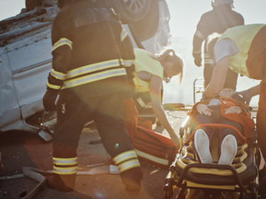 Roll over car accident with paramedics on the scene