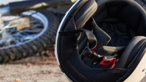 Crashed motorcycle with helmet