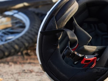 Crashed motorcycle with helmet