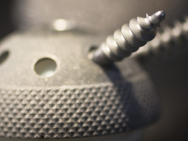 Close-up of orthopedic implant ball and screw components relevant to defective medical device product liability