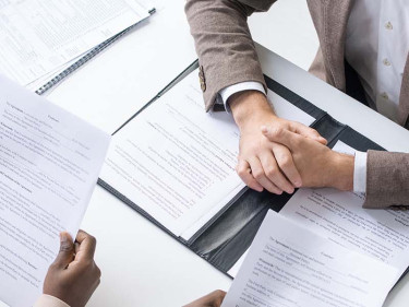 A motorcycle accident lawyer meets with clients.