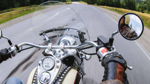 A motorcycle rider traveling down the road, hoping to avoid motorcycle accidents in Texas.