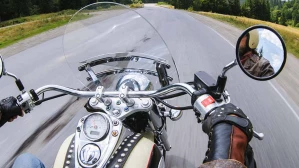 A motorcycle rider traveling down the road, hoping to avoid motorcycle accidents in Texas.