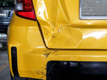 A car with parking lot accident damage