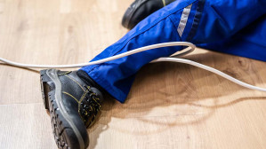 A man loses his footing, tripping on a cord left out carelessly, potentially entitling her to start a personal injury lawsuit.