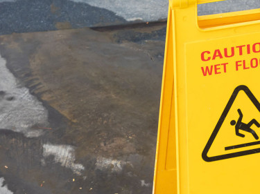Wet pavement is a common hazard addressed by slip and fall attorneys.