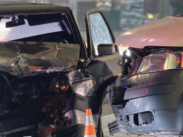 A T-bone accident occurs at a busy intersection, causing serious damage.